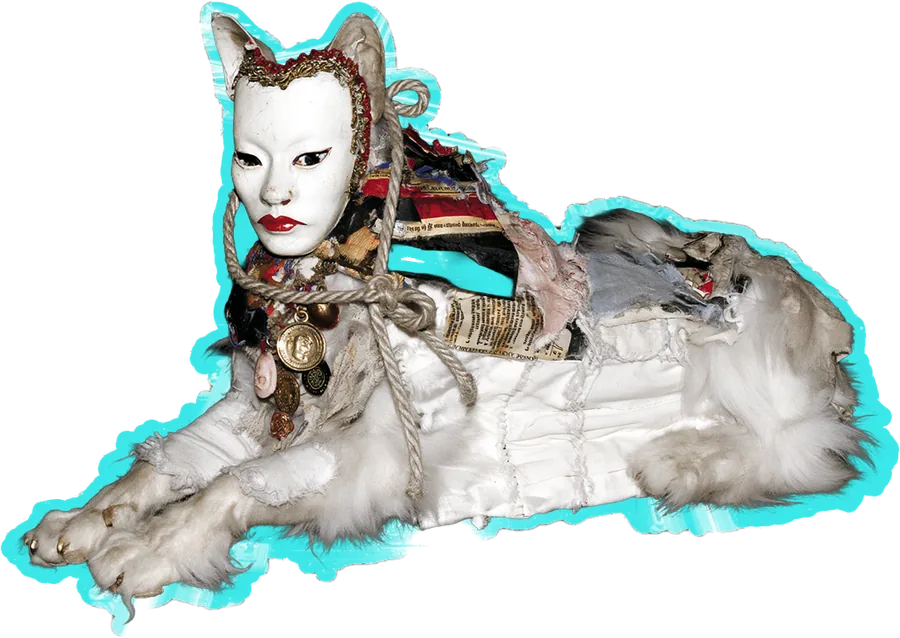 A sphinx lying down, outlined in cyan: a white noh mask with cat ears, roped in beads and charms, on a long white body